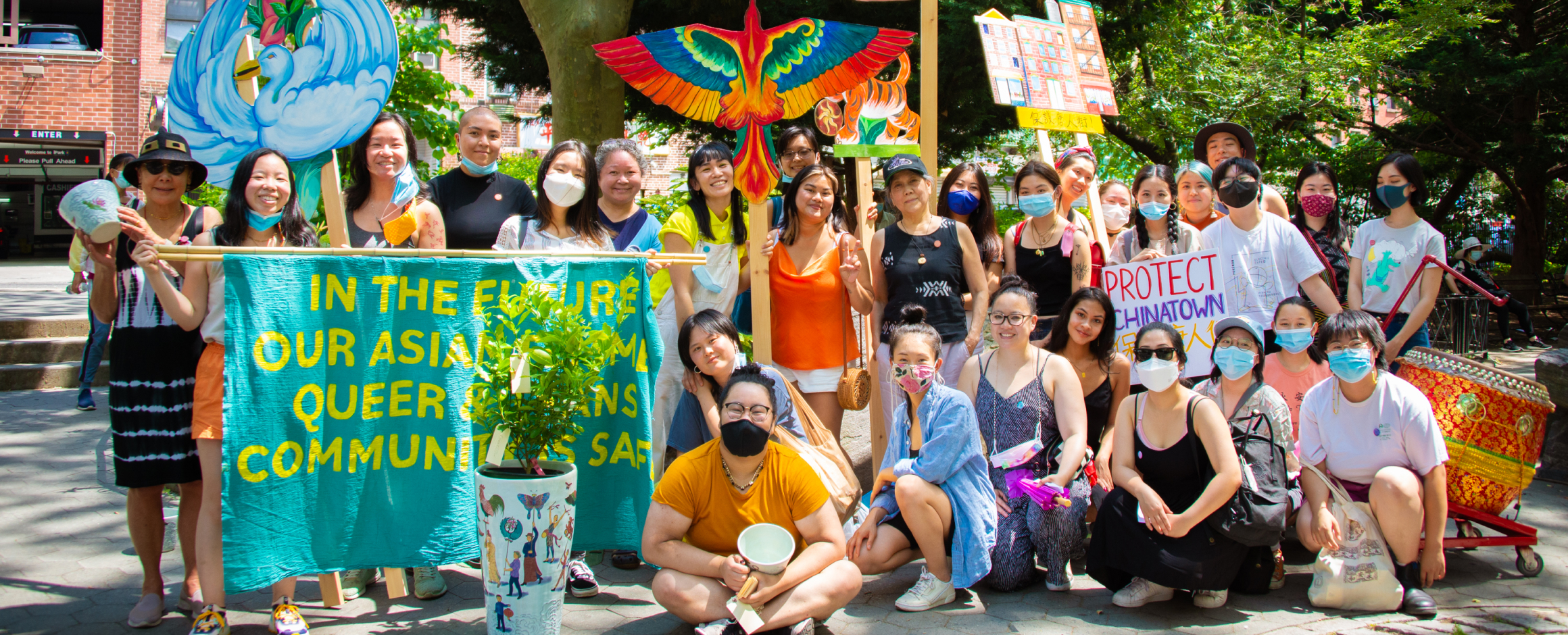 CPP Artist in Residence Mei Lum and event participants pose for a group photo to celebrate the women, queer, and trans-led spaces cultivated by the W.O.W. Project.