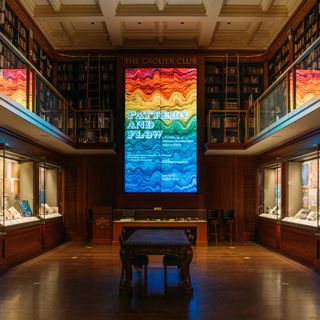 Installation photograph of the Grolier Club exhibition space with the Pattern and Flow banner