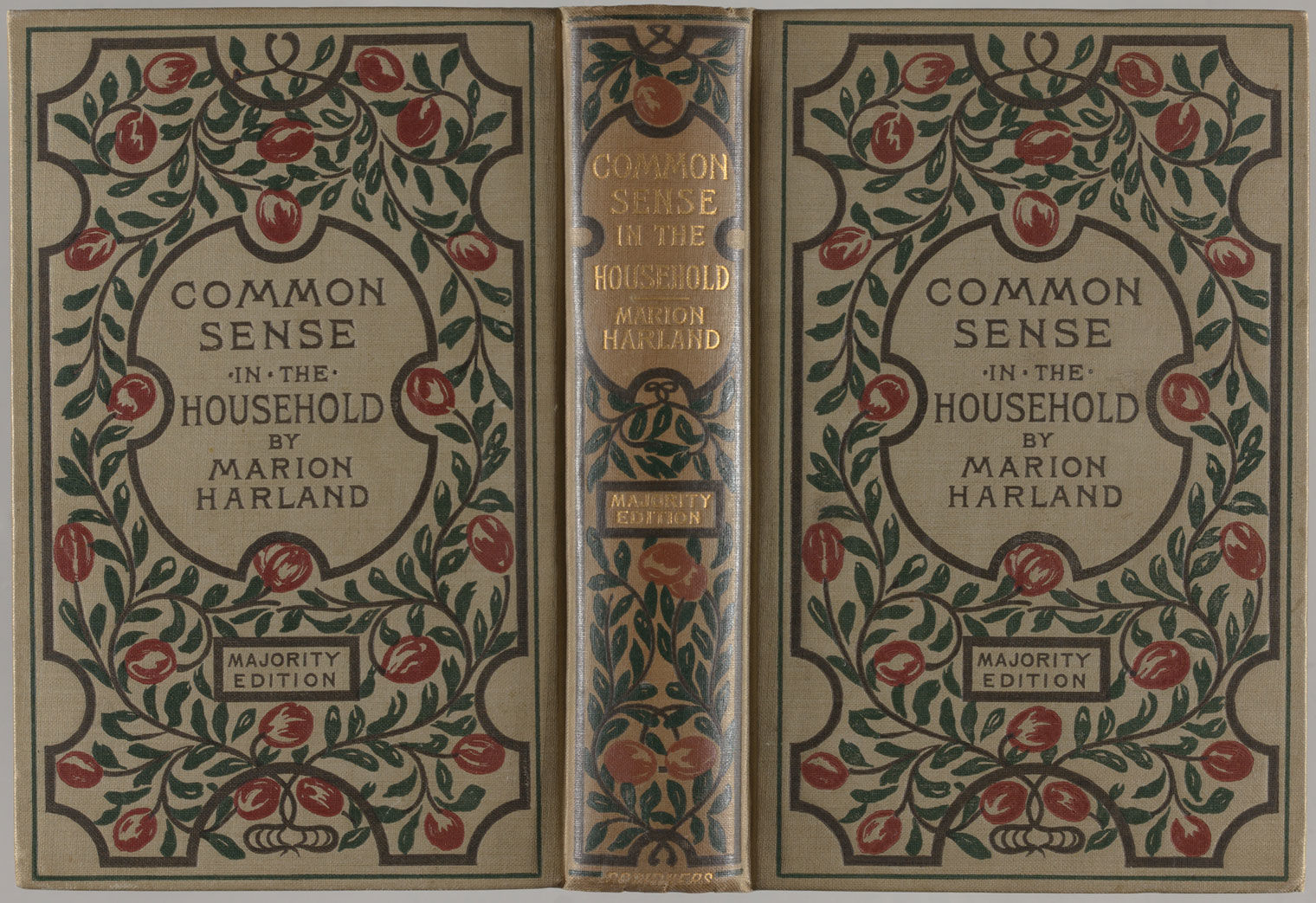 Image of the cover of a book titled "Common Sense in the Household"; pea green cloth with title and author stamped in black in center surrounded by intertwined leafy branches with round blossoms stamped in black, green, and red, with gold foil accents on spine
