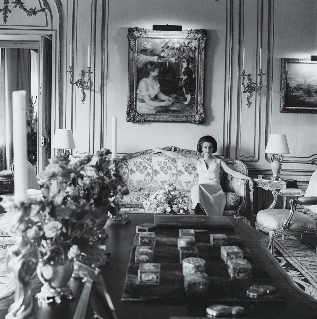 Mrs. Wrightsman seated on a sofa