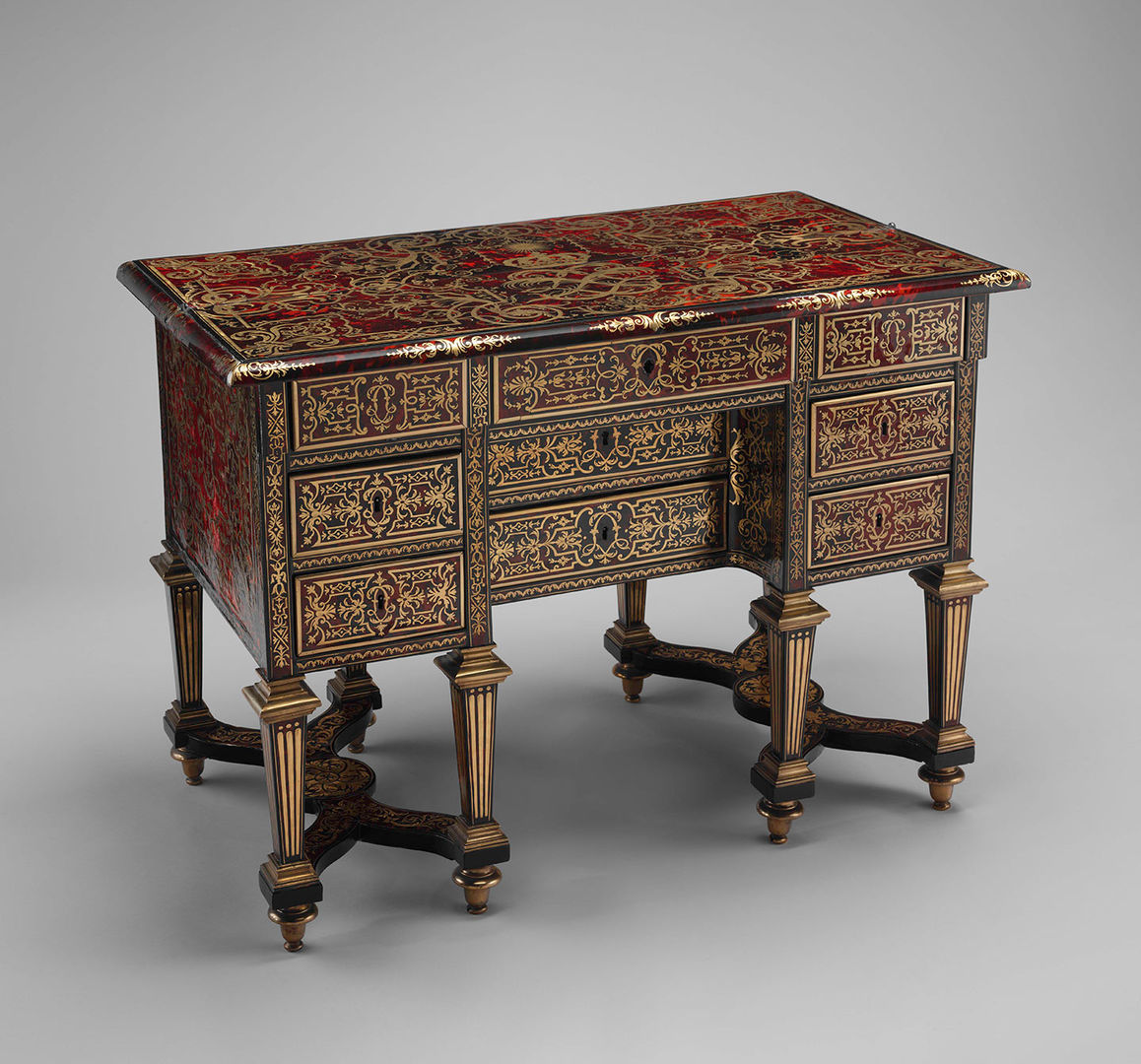 Small desk with folding top (bureau brisé), ca. 1685. Marquetry by Alexandre-Jean Oppenordt (Dutch, 1639–1715, active France); Designed and possibly engraved by Jean Berain (French, 1640–1711). French, Paris. Oak, pine, walnut veneered with ebony, rosewood, and marquetry of tortoiseshell and engraved brass; gilt bronze and steel; 30 5/16 x 41 3/4 x 23 3/8 in. (77 x 106 x 59.4cm). The Metropolitan Museum of Art, New York, Gift of Mrs. Charles Wrightsman, 1986 (1986.365.3)