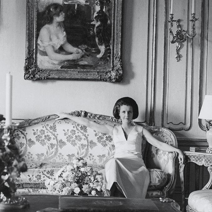 Black and white photo of Jayne Wrightsman seated on a couch