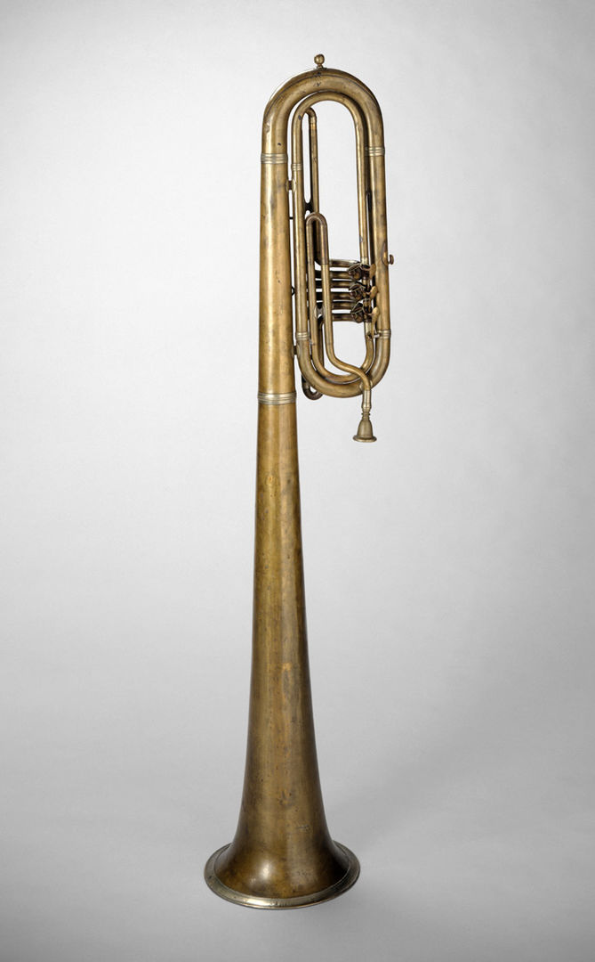 A tall low brass instrument meant to be played over the shoulder