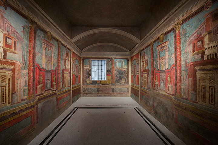 View of room from Roman villa with brightly colored, illusionistic architectural elements and landscapes