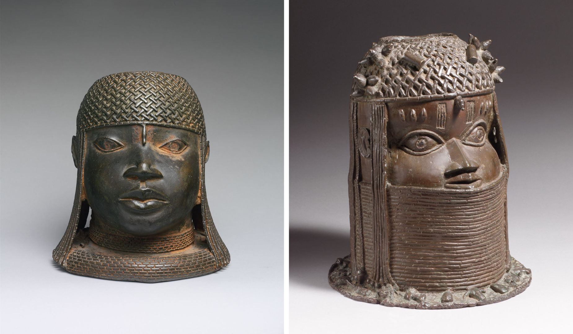 Two brass sculptures made by the Edo peoples of Nigeria depicting the heads of an oba, or royal leader