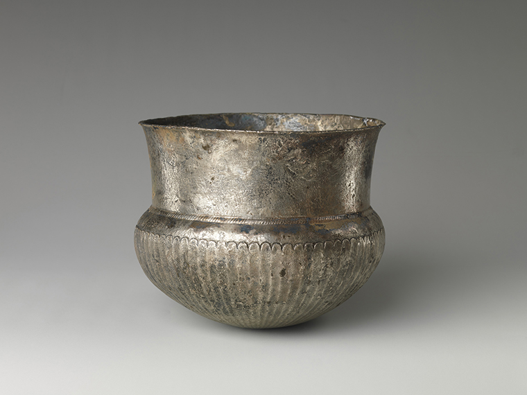 Bowl with flutes from shoulder to rosette at base