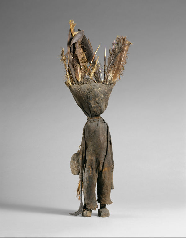 Oracle Figure (Kafigeledjo), 19th–mid-20th century. Côte d'Ivoire, northern Côte d'Ivoire. Senufo peoples. Wood, iron, bone, porcupine quills, feathers, commercially woven fiber, organic material; H. 32 7/16 x W. 13 x D. 4 1/2 in. (82.5 x 33 x 11.4 cm). The Metropolitan Museum of Art, New York, The Michael C. Rockefeller Memorial Collection, Gift of Mr. and Mrs. Raymond Wielgus, 1964 (1978.412.488)
