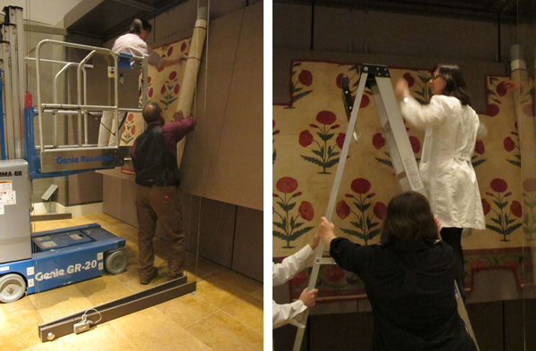 Left: Fig. 7. The pinning and unrolling of the textile during installation (1982.239a). Right: Fig. 8. Minor adjustments are made and more pins are added by conservators (1982.239a). Photos by Laura Peluso