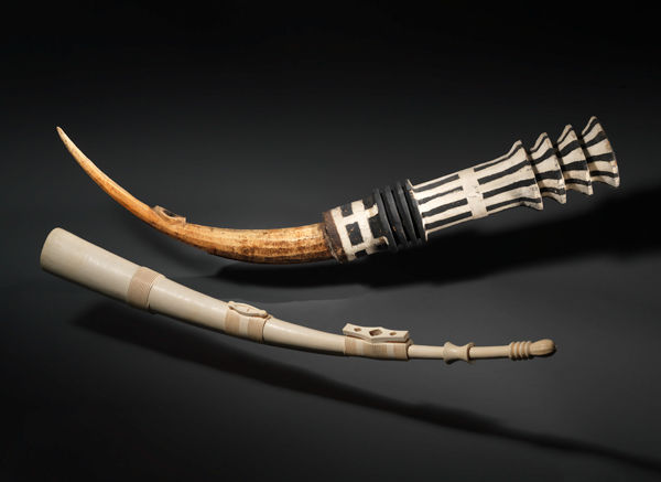 Top: Bondjo, ca. 1915. Democratic Republic of the Congo. Ekonda people. Ivory, wood, polychrome; L. 55 in. (139.5 cm). The Metropolitan Museum of Art, New York, Purchase, Rogers Fund, Roger L. Stevens Family Fund Gift, Gifts of Herbert J. Harris, and Brian and Ann Marie Todes, by exchange, Kay T. Krechmer Bequest, in memory of her husband, Harold H. Krechmer, and funds from various donors, 1992 (1992.326). Bottom: Sideblown Trumpet, 19th century. Democratic Republic of the Congo. Mangbetu peoples. Ivory; L. 50 in. (127 cm). The Metropolitan Museum of Art, New York, Purchase, Bequest of Olive Huber, by exchange, and Brian and Ann Marie Todes Gift, 1999 (1999.74)