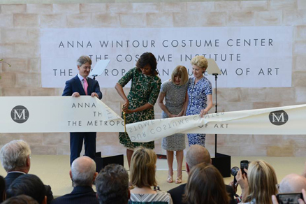 First Lady Michelle Obama cutting the ribbon to open The Costume Institute's new Anna Wintour Costume Center