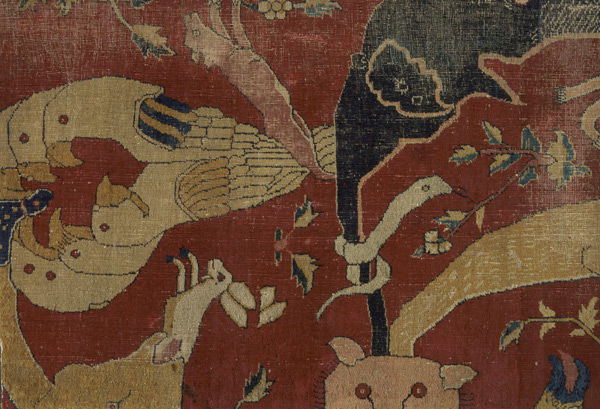Fragment of an animal carpet depicting a snake, a hare, and a fox