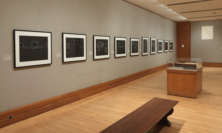 Gallery view of a wall of 10 aquatint prints, each depicting a mathematical equation