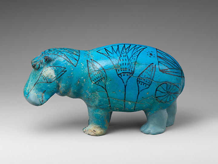 Blue hippo with black lotus flower designs on his skin