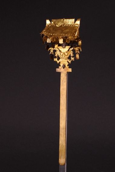 An ornate golden scepter from ancient Peru