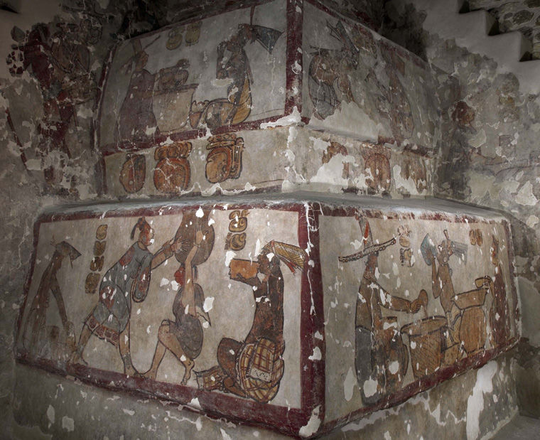 A photo of colored murals made in an ancient Maya burial complex