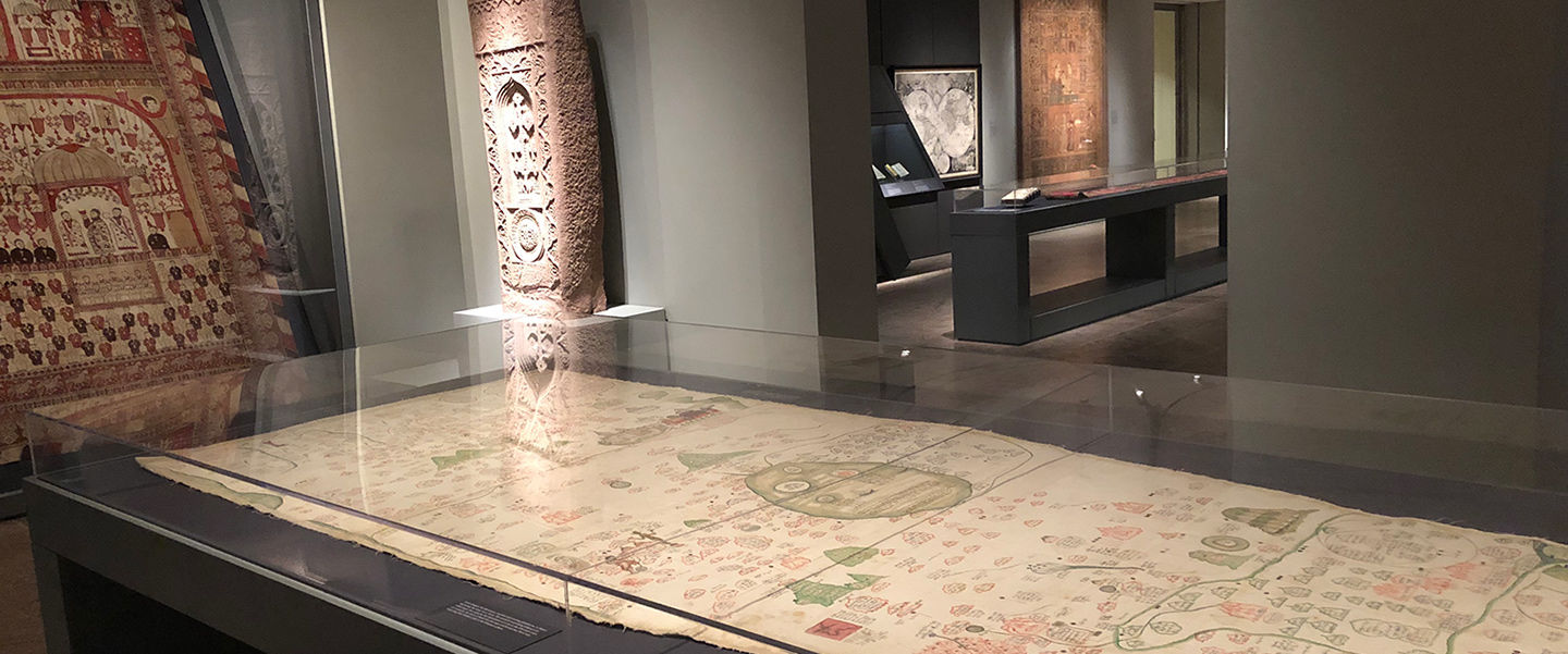 View of the map lying in a glass display case in the gallery