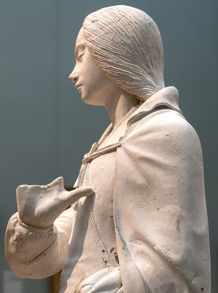A profile view of a statue of the Virgin Mary