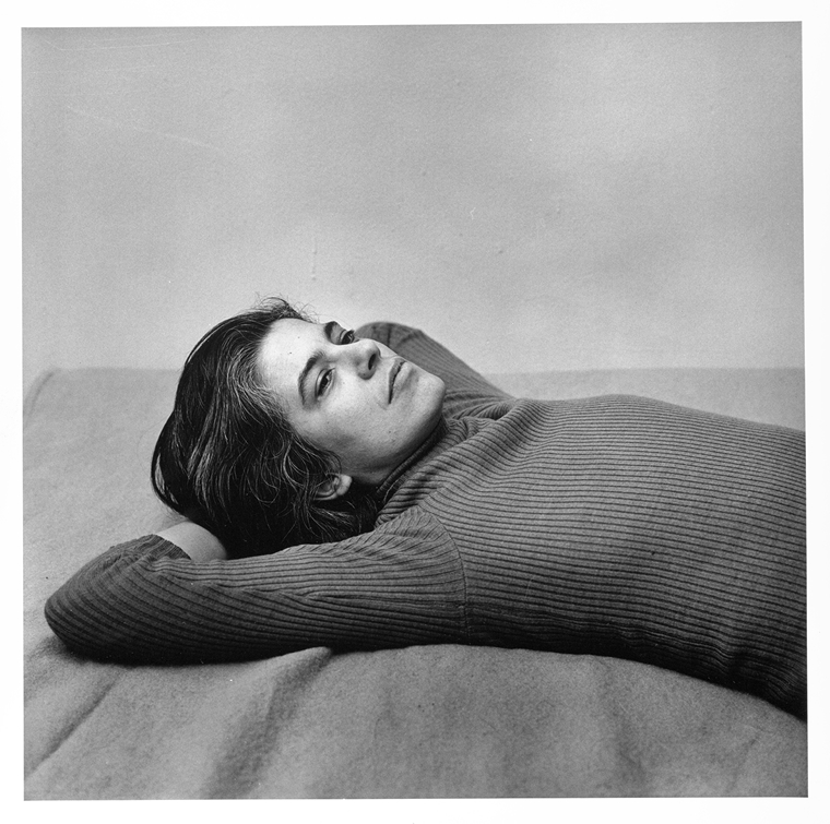 Black-and-white photo of Susan Sontag in a reclining position by Peter Hujar.