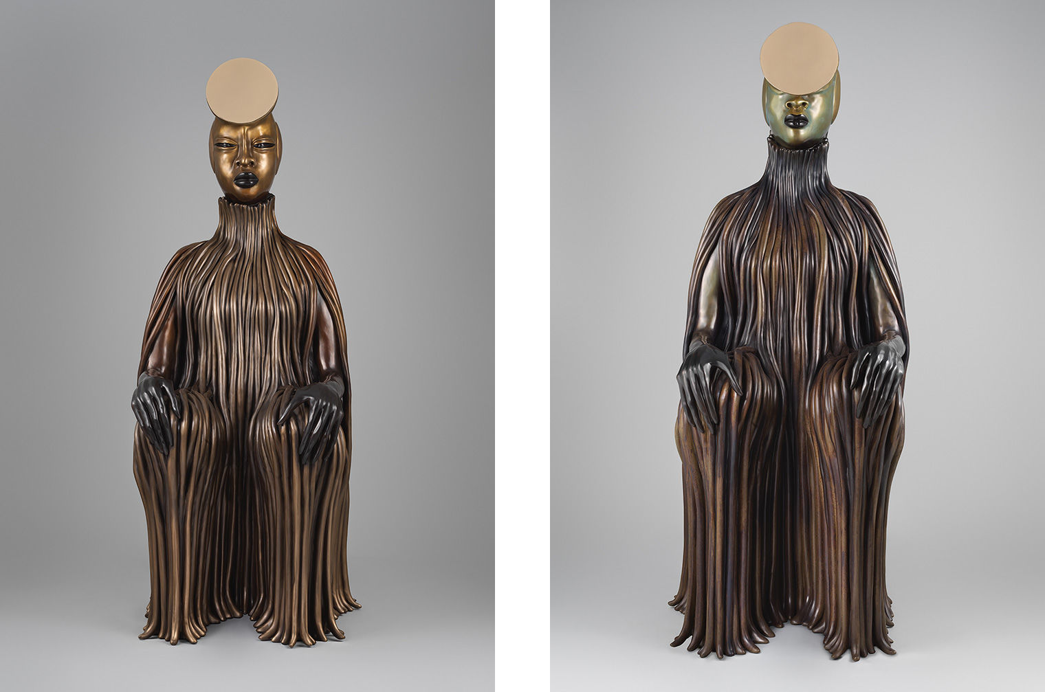 Two patinated bronze sculptures of seated women with coils and mirrored surfaces