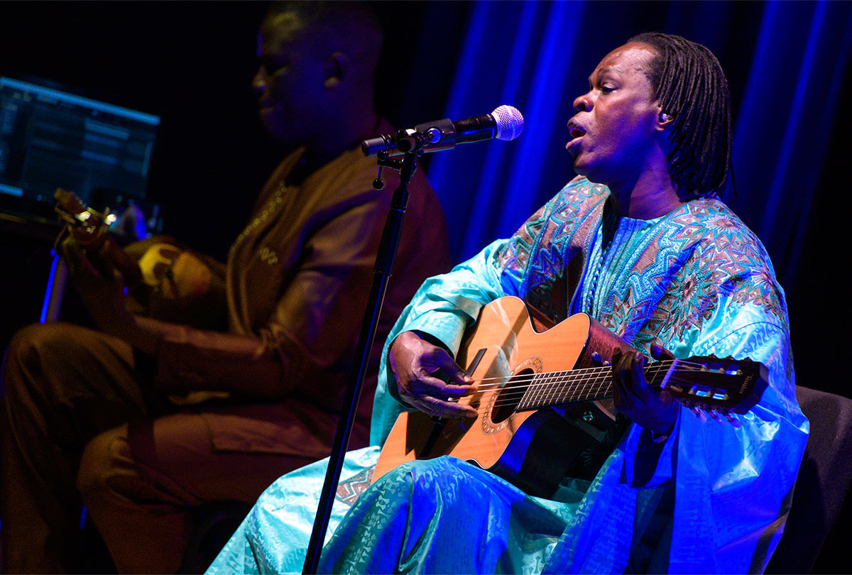 Senegalese singer Baaba Maal, in blue, performs an acoustic concert with Cheikh Ndiaye (left) at The Met.