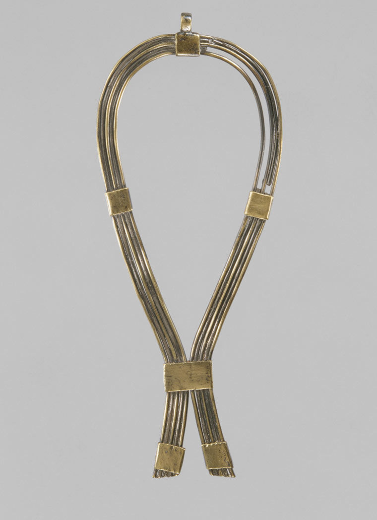 Iron and gold looping into a necklace