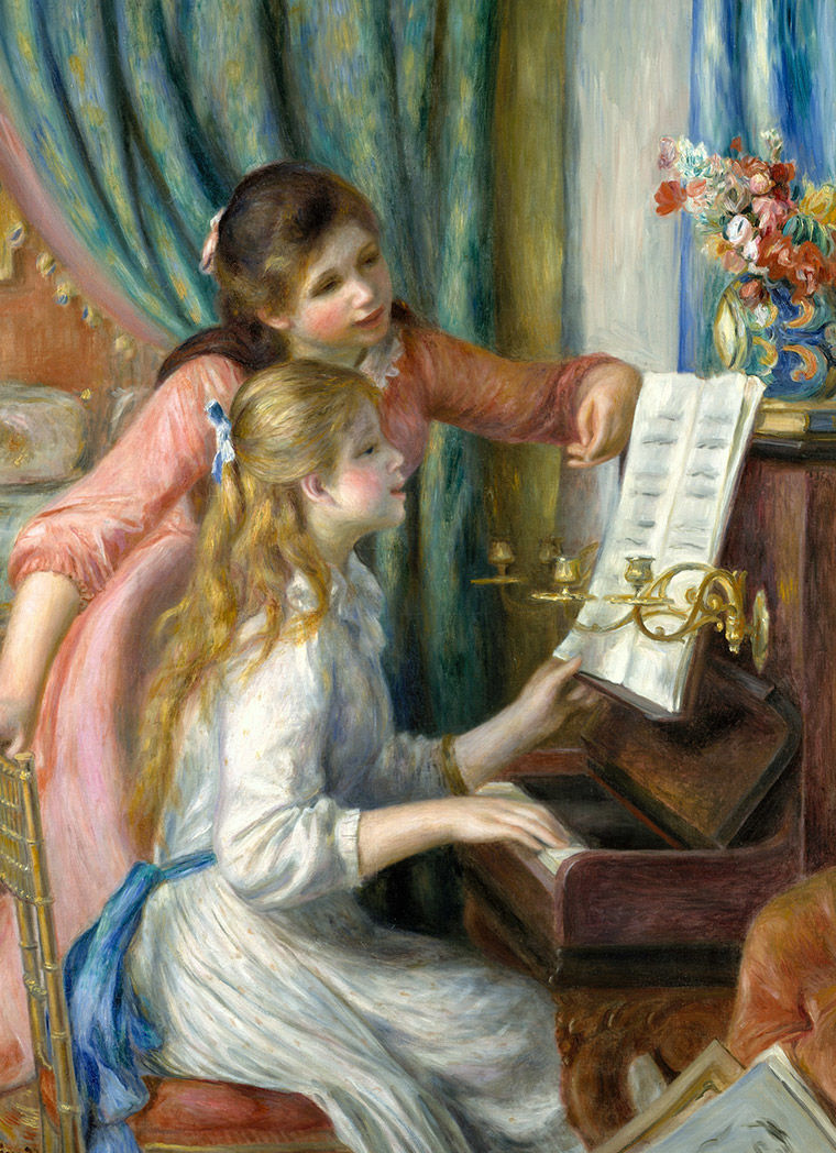 Two girls sit near a piano, hovering over a sheet of music