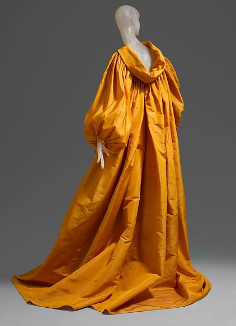 Mannequin with a golden orange gown