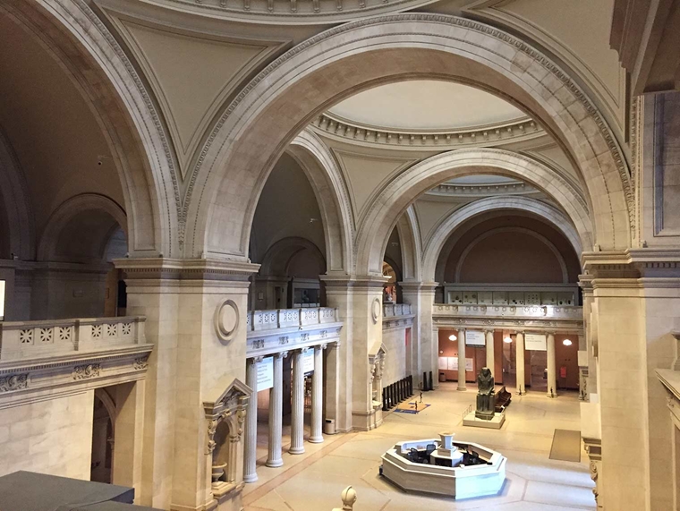 A photo of The Met's great hall, almost entirely empty, taken from the mezzanine balcony.