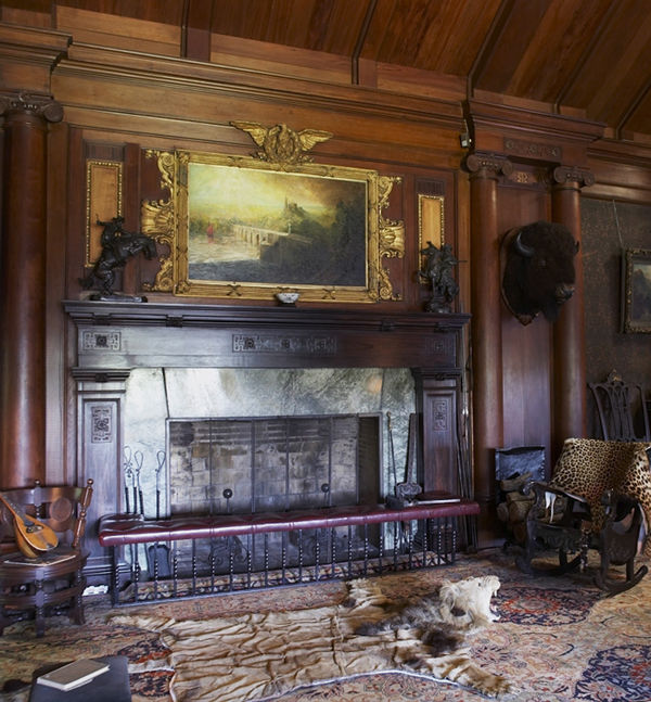 View of fireplace in the North Room at Sagamore Hill National Historic Site with Frederic Remington's The Broncho Buster (left) and Frederick William MacMonnies' Kit Carson (right)