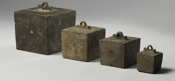 Four cuboid pan-balance weights (BC11-3183, BC11-3246, BC11-3202, BC11-3270). Museo Nacional de Arqueología Subacuática, Cartagena