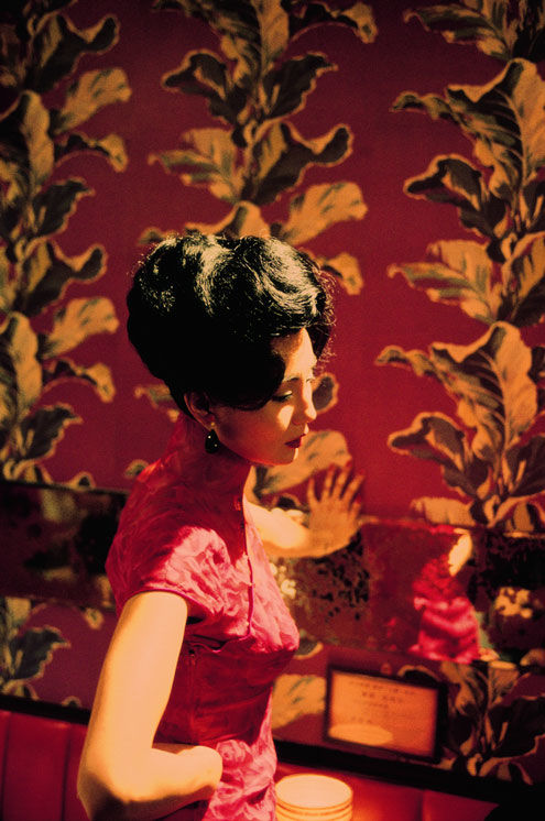 Film still showing woman in red dress