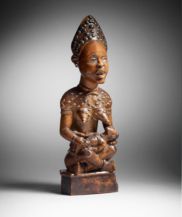 Figure: Seated Female Nursing Child