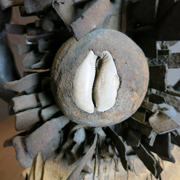 Detail of object showing cowrie shell