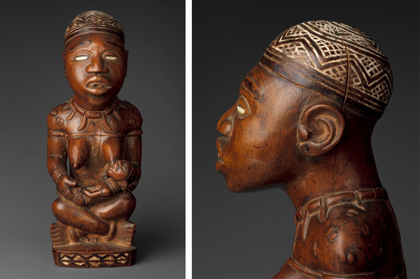 Seated Female Nursing Child