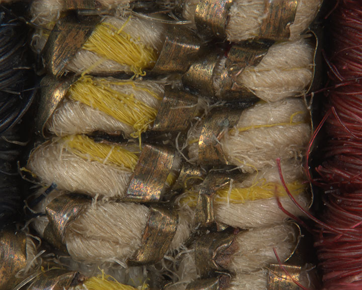 Magnified view of weave showing golden metallic strip