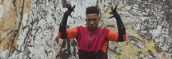 Dancer Omari Mizrahi dances in front of Mark Bradford's "Duck Walk"