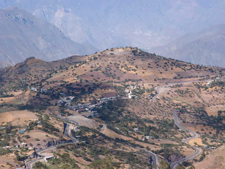 Photo of Kuntur Wasi site, surrounded by mountains