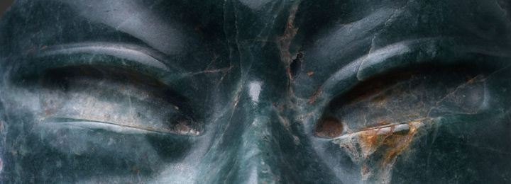 Detail view of an ancient Olmec mask made of jadeite