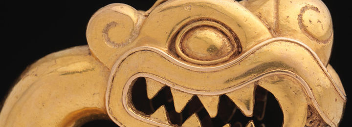 Detail view of an Aztec gold ornament in the shape of a serpent