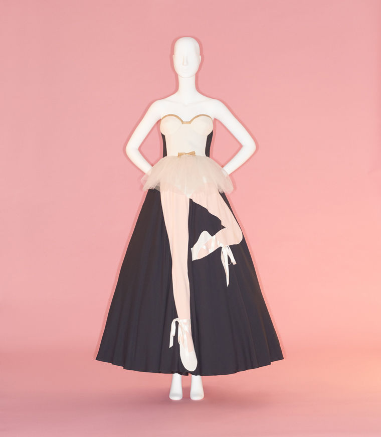 Evening dress with an ankle-length black skirt overlaid with fabric in the design of a tutu and ballet dancer legs in pointe shoes