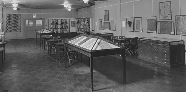 Archival photograph of "European Textiles and Costume Figures," with students and a teacher from Hunter College’s new Bronx campus, Walton High School, 2780 Reservoir Avenue, The Bronx, 1939