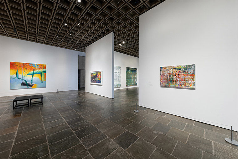 Installation view of several colorful abstract paintings from Gerhard Richter: Painting After All at The Met Breuer