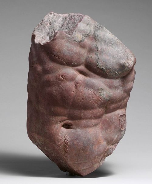 Red statue of a male torso