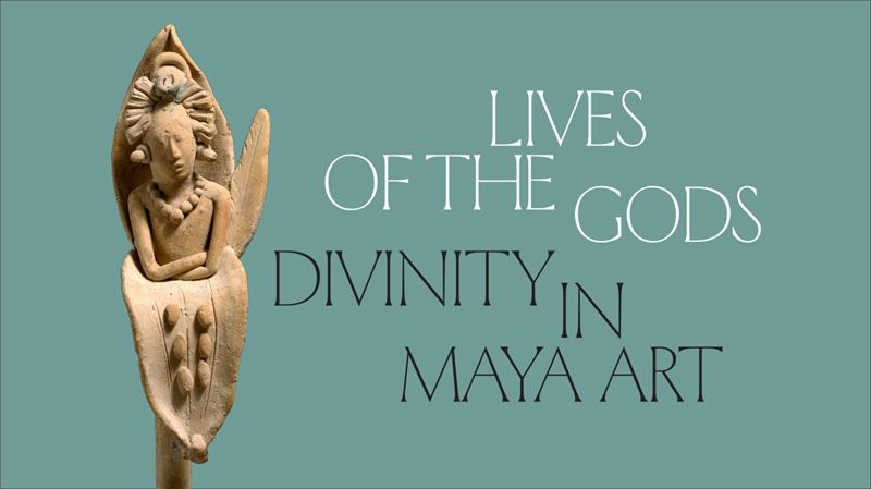 Ceramic Maya whistle with the Maize God emerging from a flower with the text 