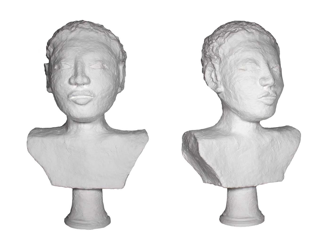 White sculpture of a head and upper torso.
