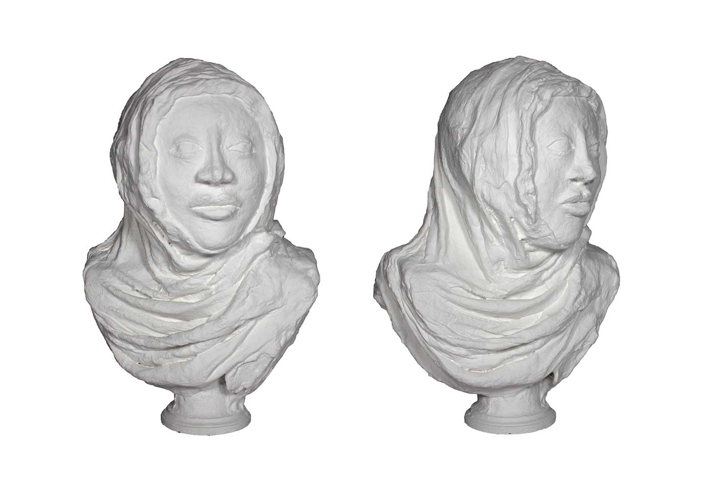 Beige sculpture of a woman's head and upper torso wearing a hijab.