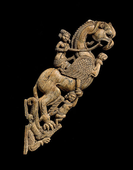 Bracket with a female riding a fantastic creature