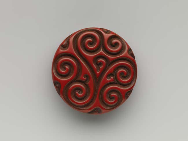 Box with pommel scroll design