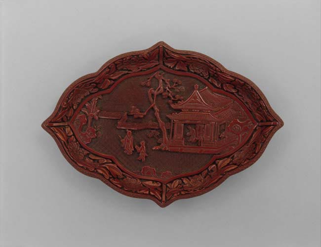 Lozenge-shaped dish with figures in a landscape