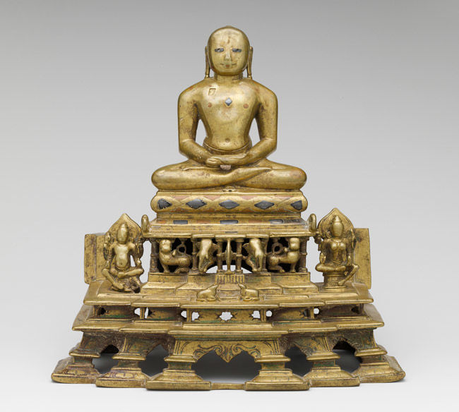 Svetambara Enthroned Jina, with Attendant <i>Yaksha</i> and <i>Yakshi</i>